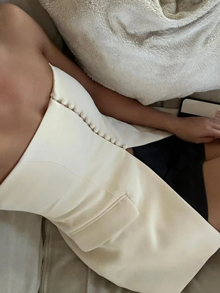 Claudia™ l Elegant stropløs top med klaplommer